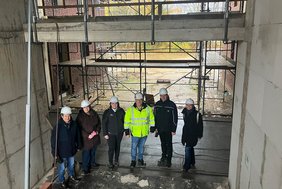 Dieses Foto zeigt die vielen Partner, die für die neue Kita zusammenarbeiten